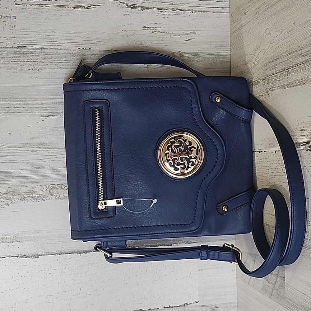 Blue crossbody purse long strap golden emblem some wear to corners